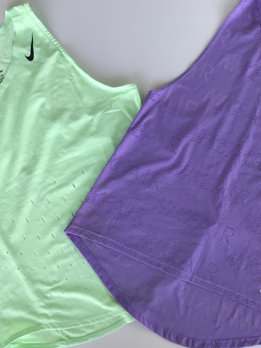 TWO Nike athletic tops. M, DRI Fit and laser cut patterns.